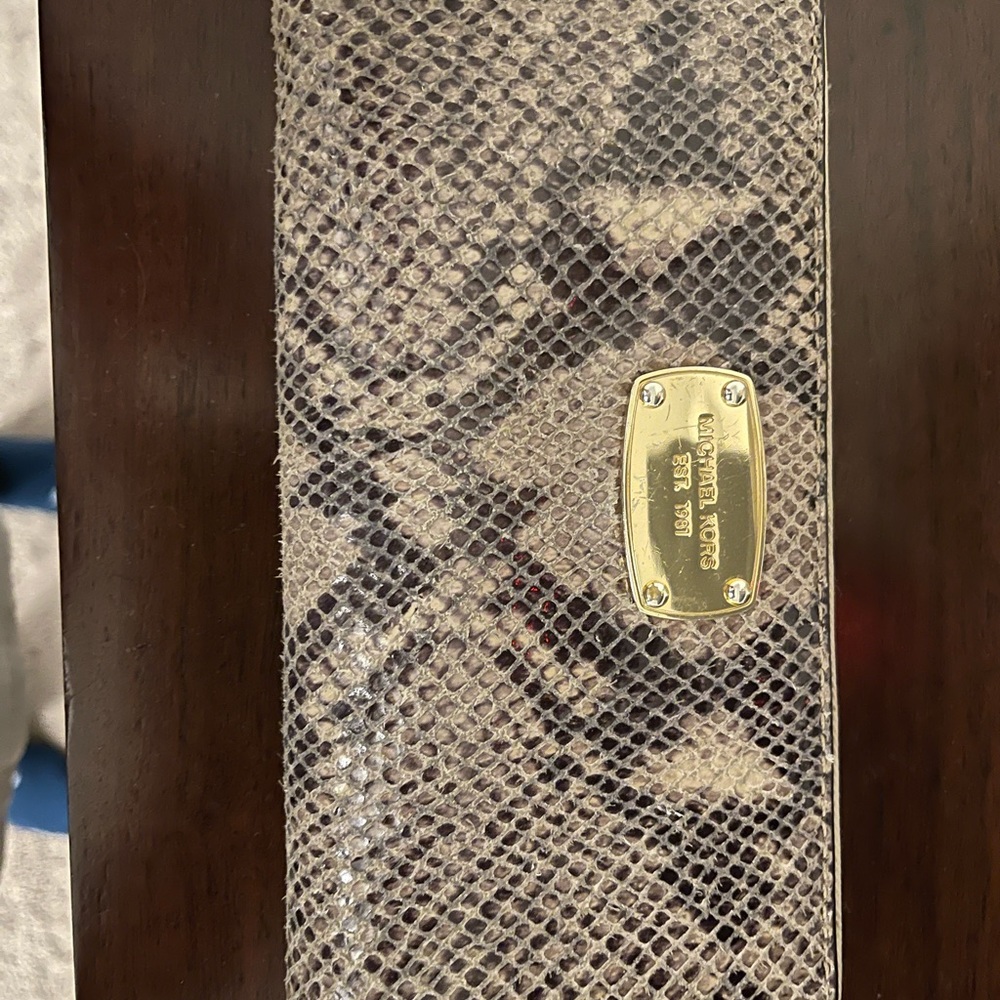Well loved Michael Kors Wallet but in good used shape.